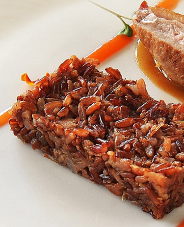 foto ricetta Petto d'anatra arrostito, tortino di Riz Rouge e coscia brasata 