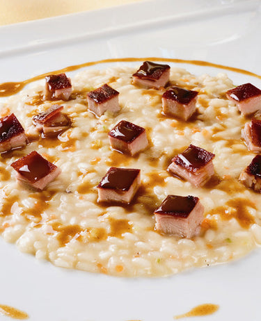 foto ricetta Riso Vialone nano mantecato al profumo di cannella e costine di maialino allo spiedo 
