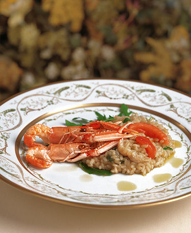 RISOTTO AU CITRON ET GAMBAS ACCOMPAGNÉ DE ROQUETTE SAUVAGE 