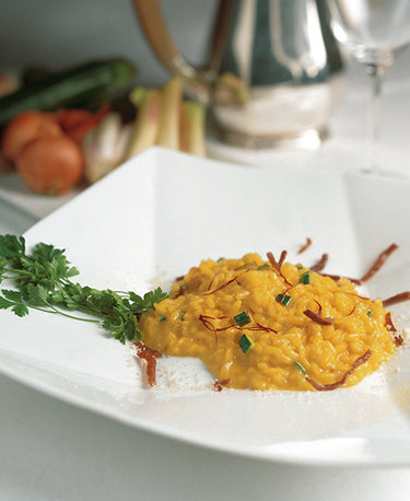 RISOTTO WITH COURGETTE FLOWERS, TRUMPET COURGETTES, FRESH ALMONDS AND PARMA HAM 